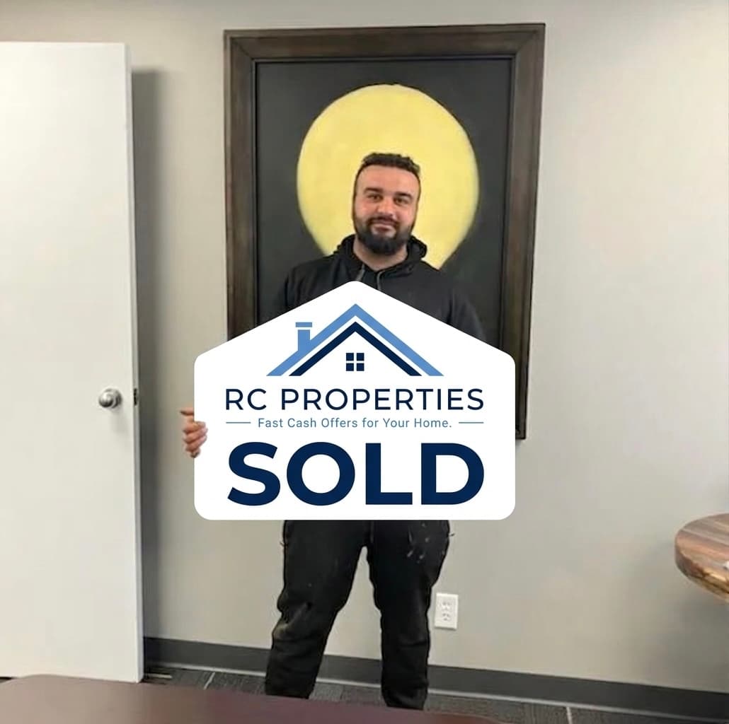 RC Properties customer holding a sold sign