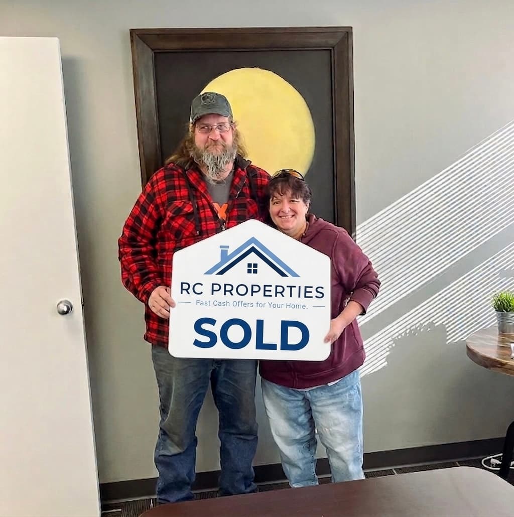 Homeowner with RC Properties sold sign
